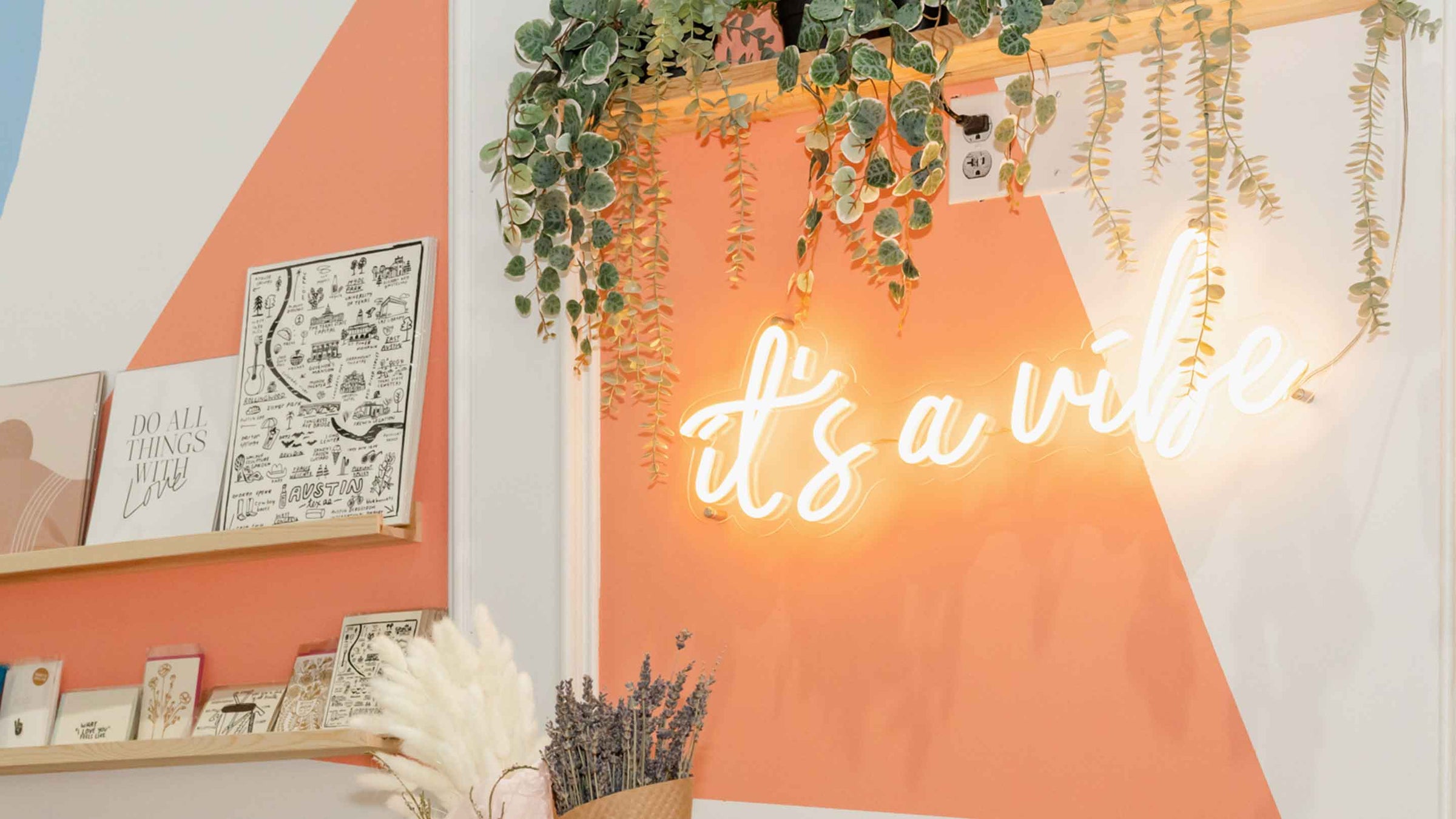 Neon Sign on wall that says It's a Vibe