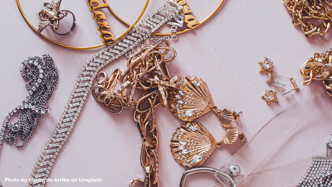 Different types of jewelry on a pink background