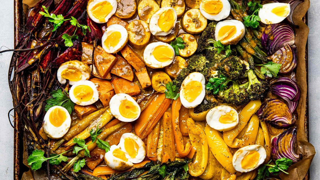 A pan of roasted vegetables and eggs