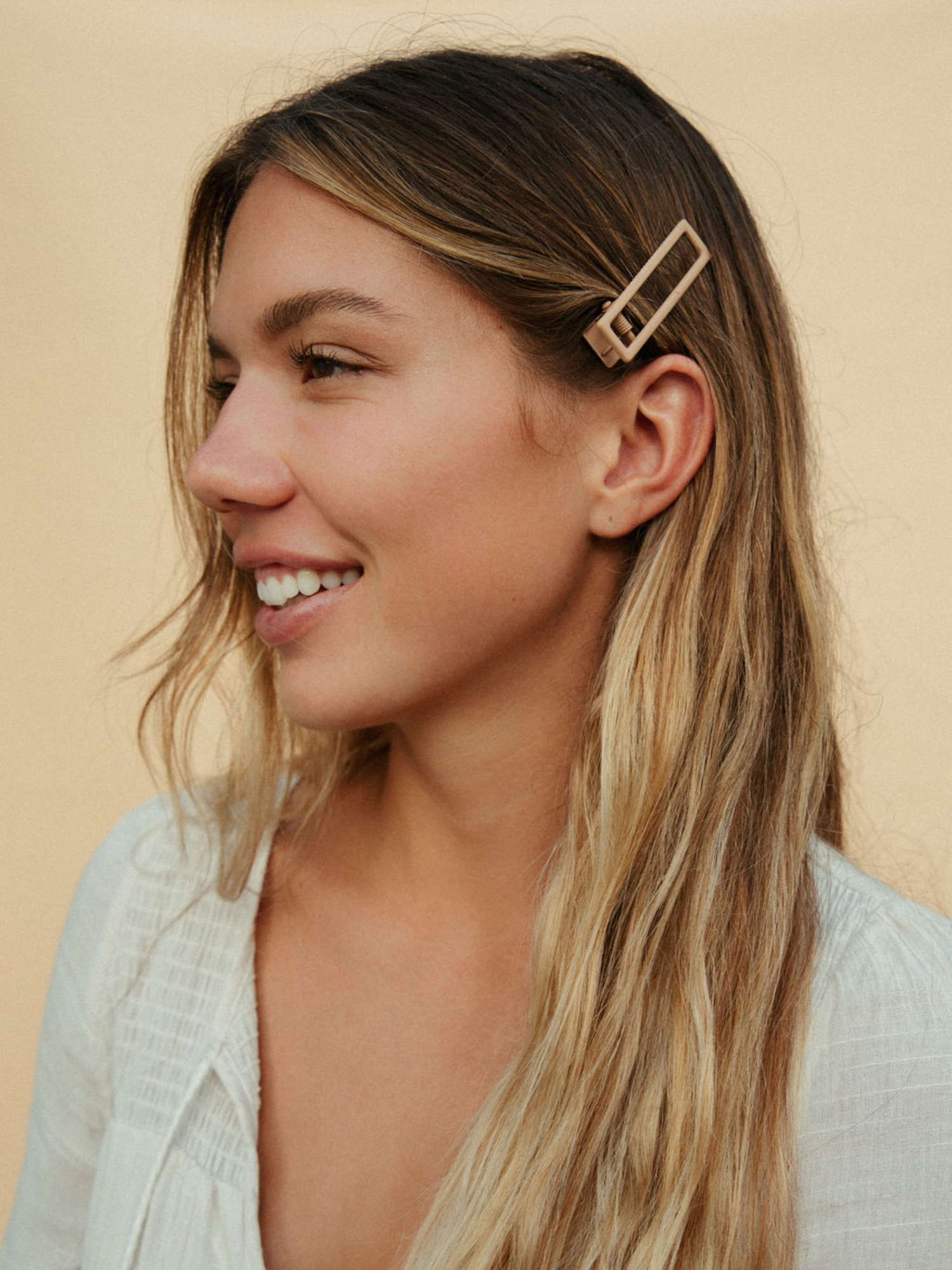 model wearing hair clips in hair as example for size reference