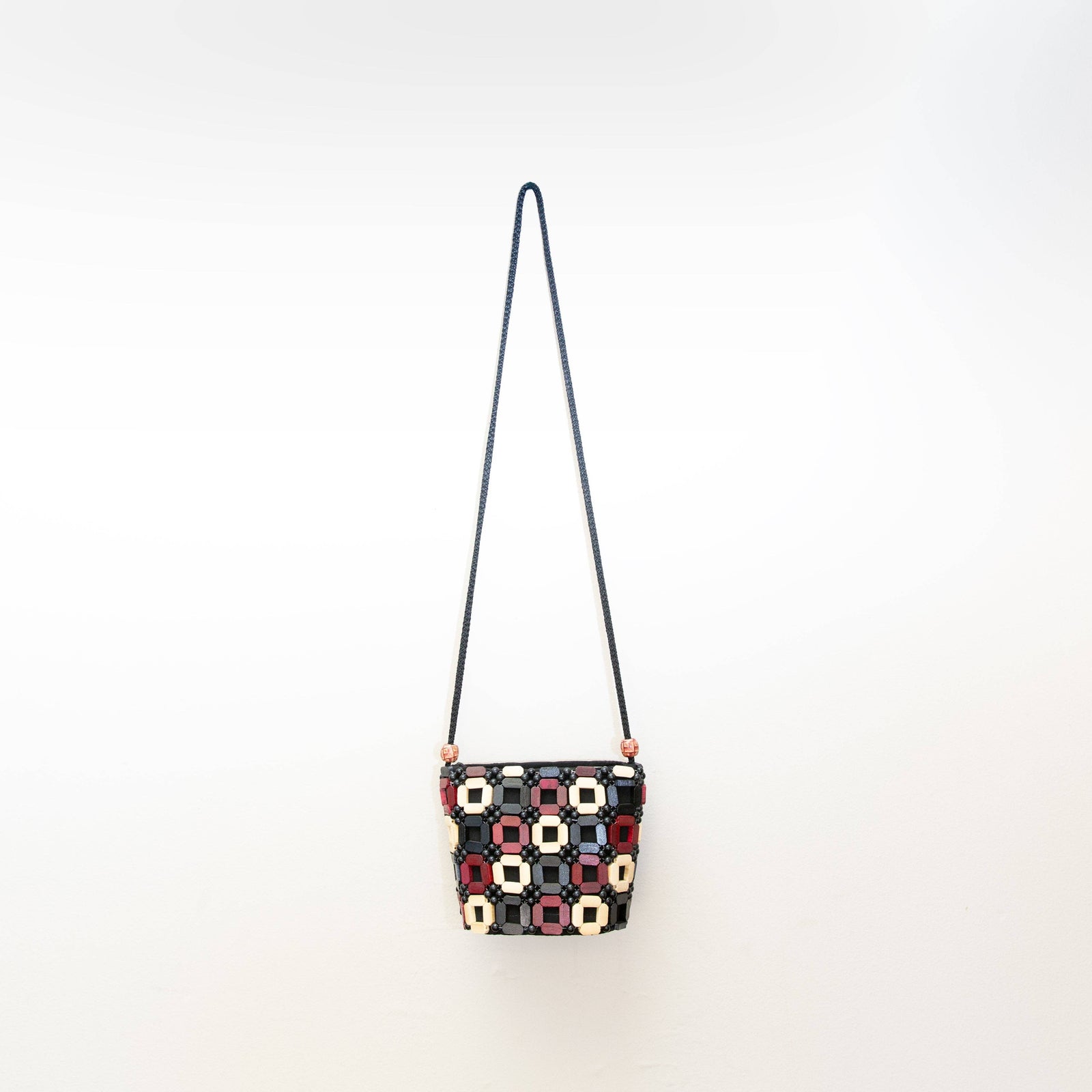 Small handbag with geometric pattern on a white background