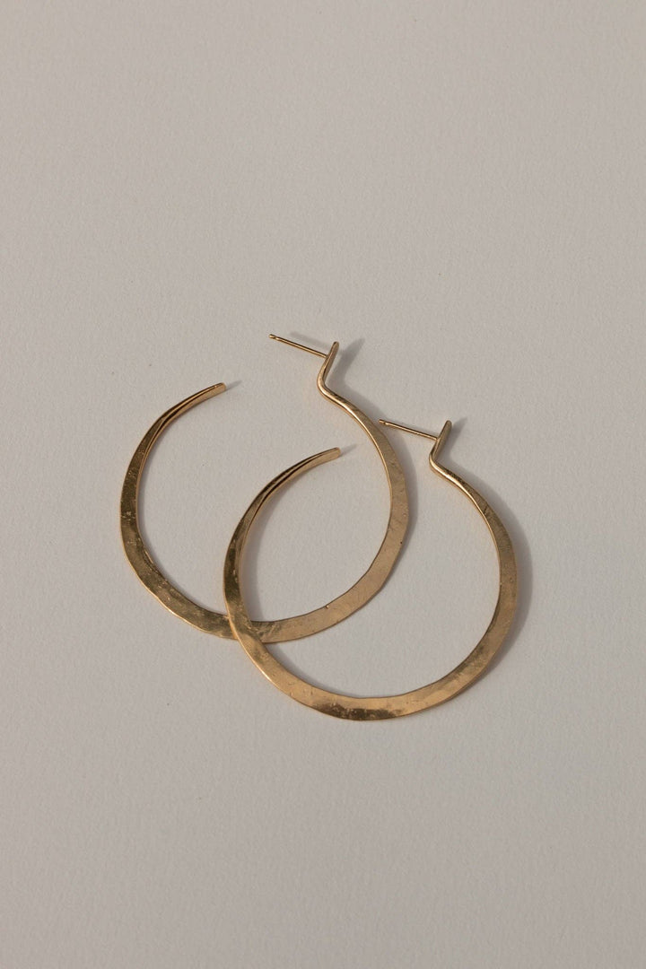  ‘Lenga’ Hoops (meaning ‘Create’ in Tumbuka) are handcrafted from brass and sterling silver posts coated in a luxuriously thick layer of 14k recycled gold 