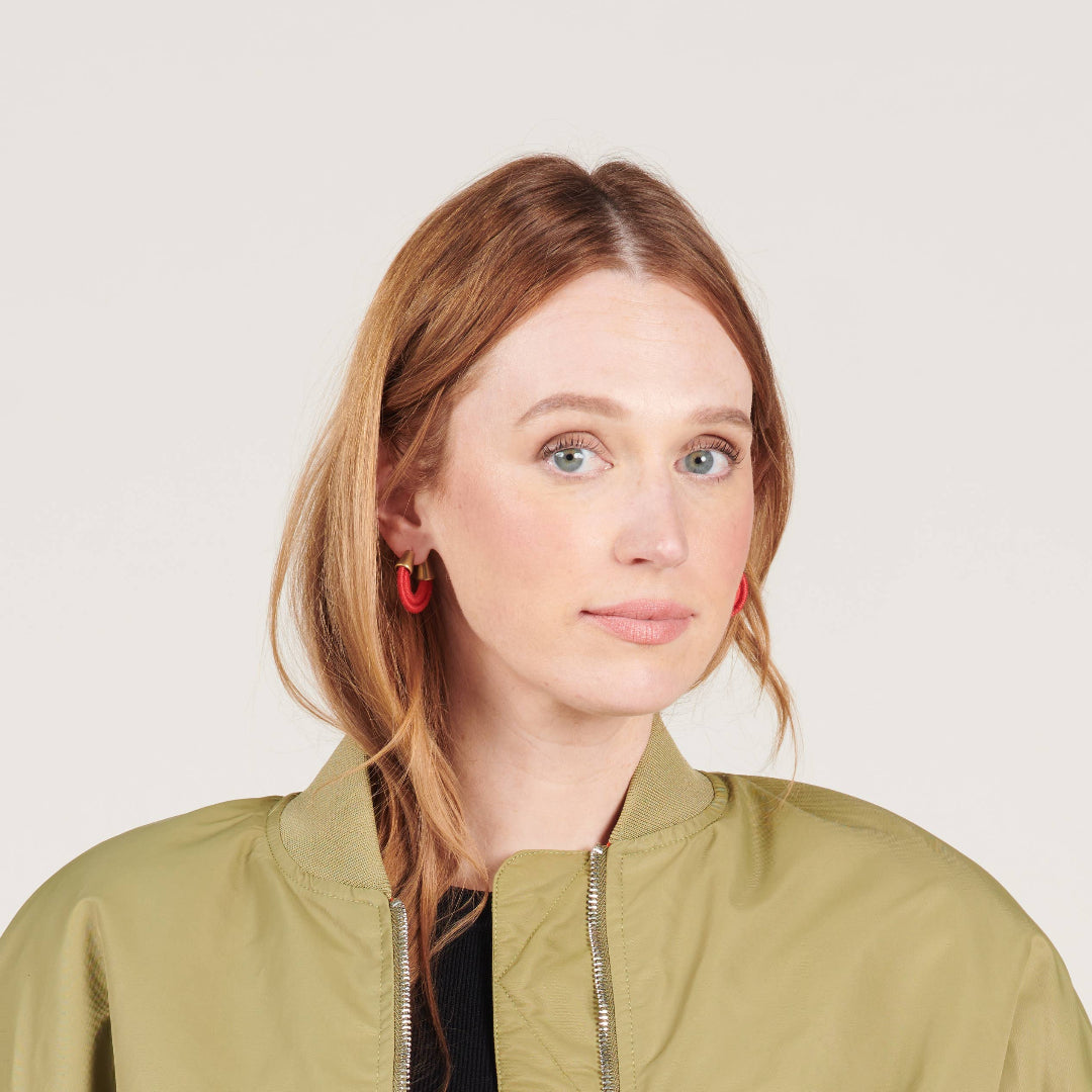 woman wearing fiber earrings