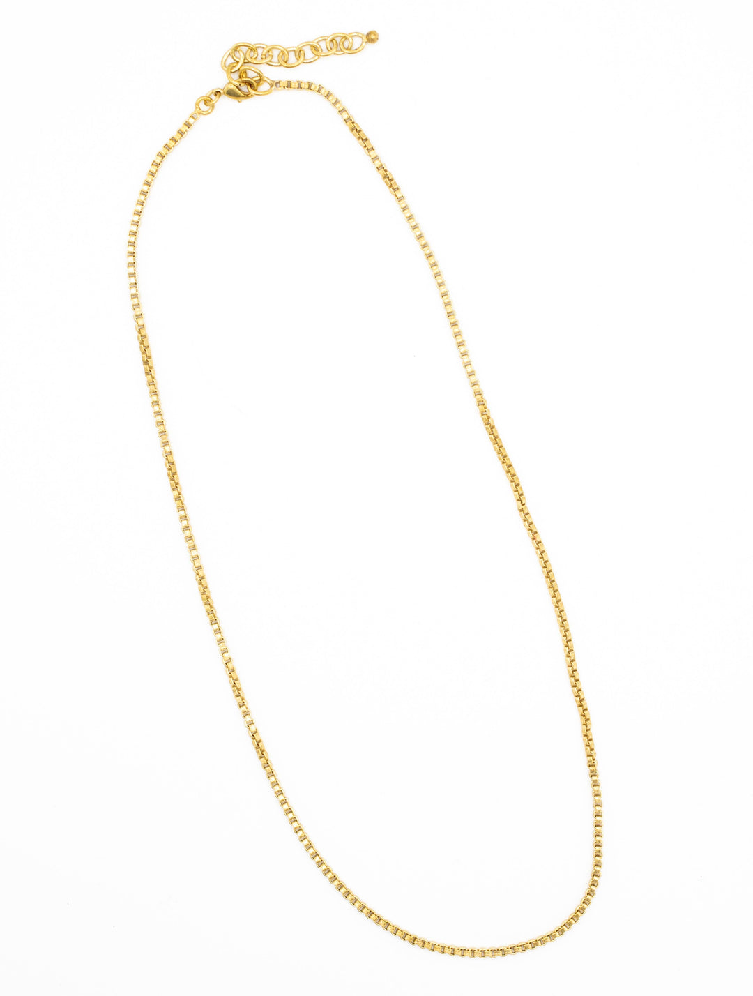 brass necklace on a white background