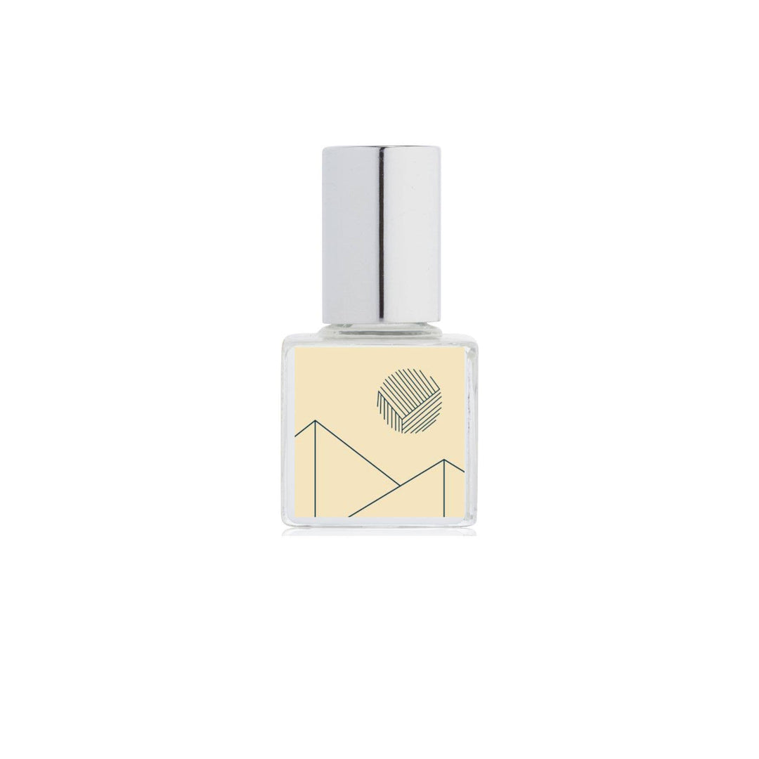 Small square bottle with a silver cap on a white background