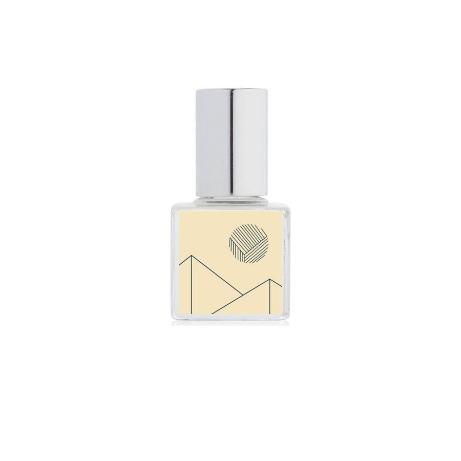 Small square bottle with a silver cap on a white background