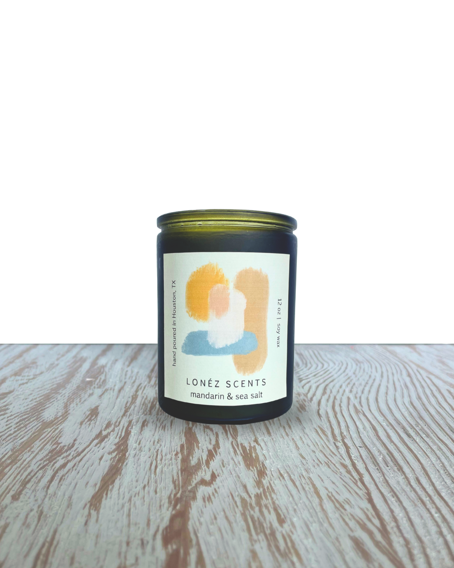 Candle with a label on a wooden surface label Lonéz Scents - MANDARIN & SEA SALT