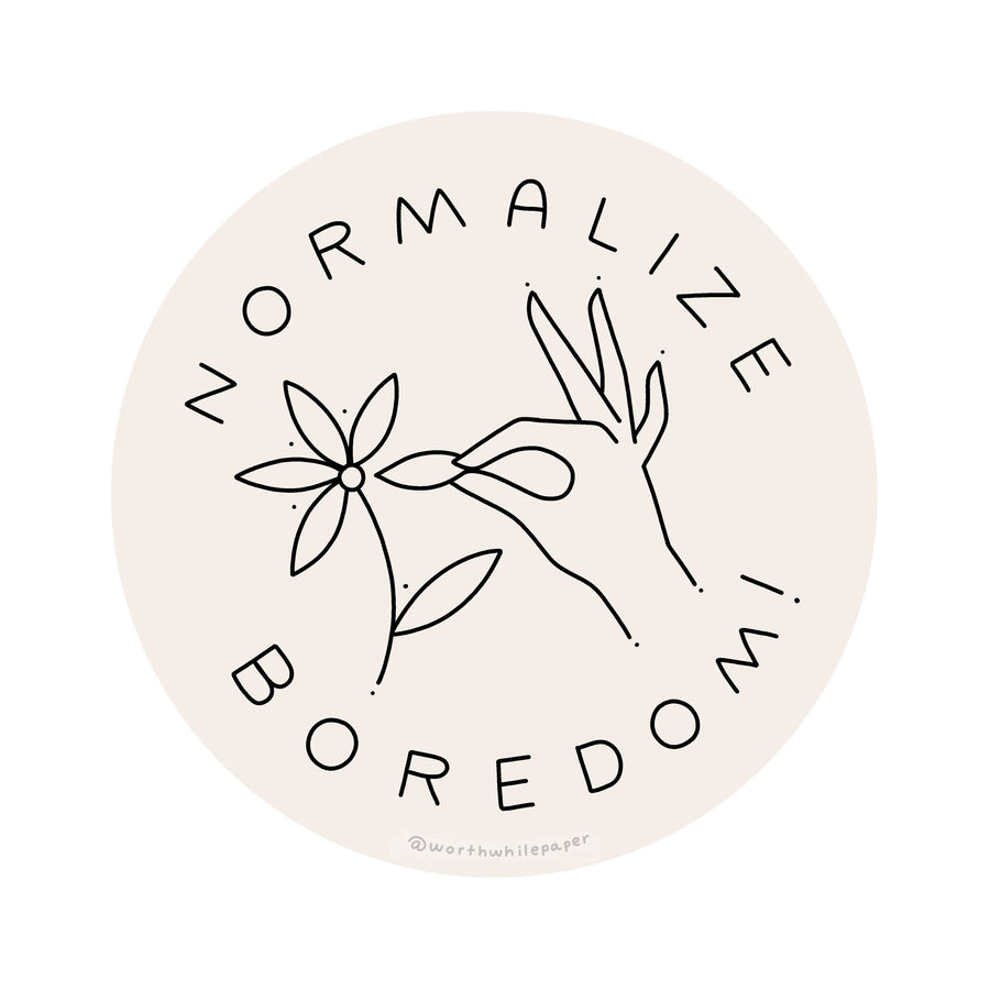Circular sticker with hand-drawn elements and text 'Normalize Boredom' on a light pink background.