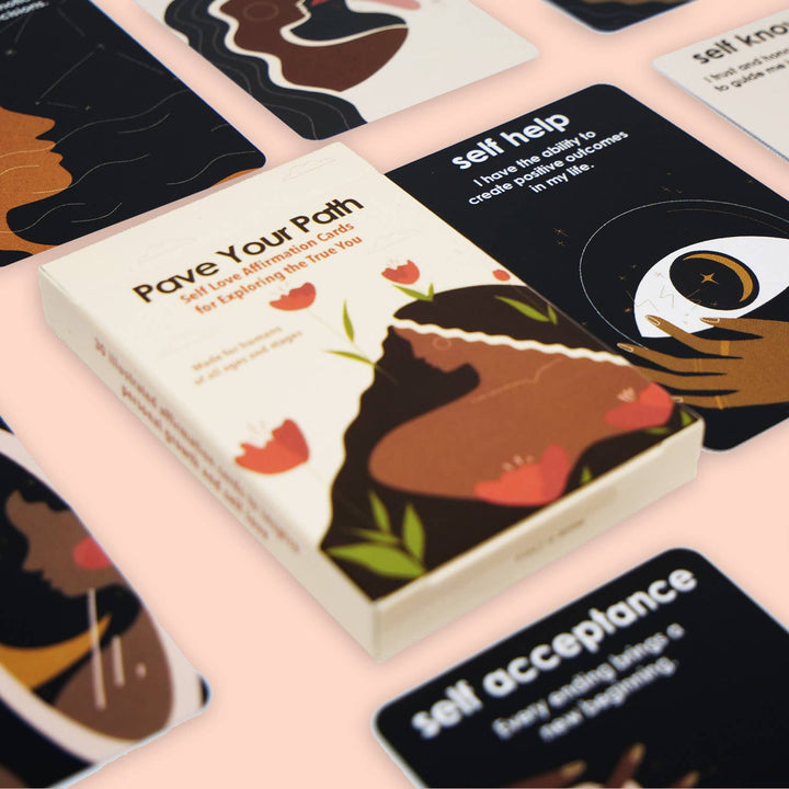 affirmation Card  box titled 'Pave Your Path' with cards featuring illustrations on a pink surface.