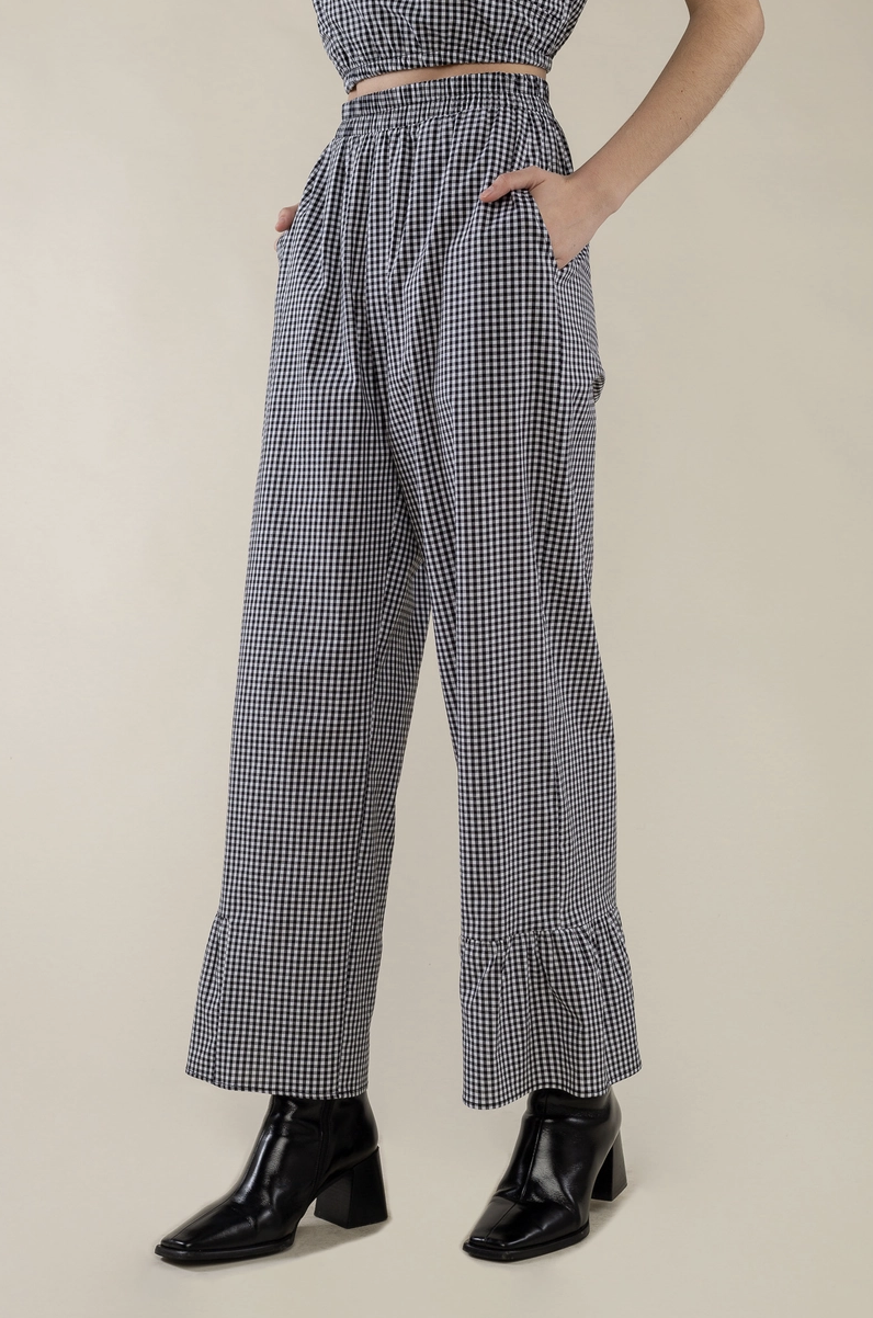 Gingham pant with elastic at waist, side pockets, and half ruffle at hem