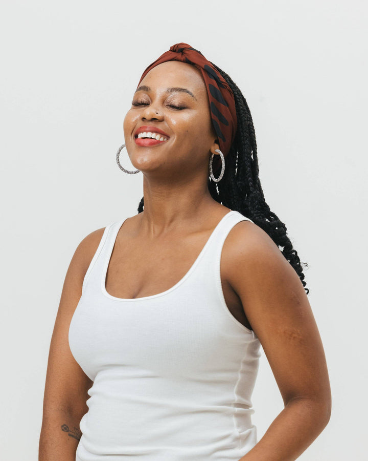 The Wrap Life - Satin Head Scarf in Mahogany: Brown Hair accessories brown background with black shapes 