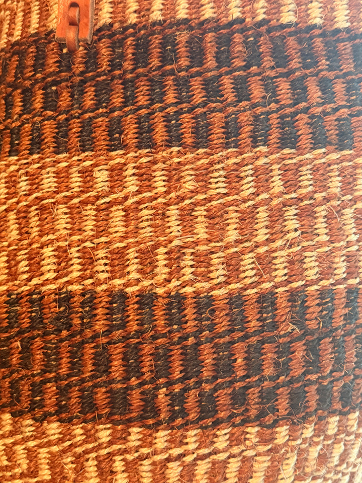 Close-up of a woven bag with brown and black pattern