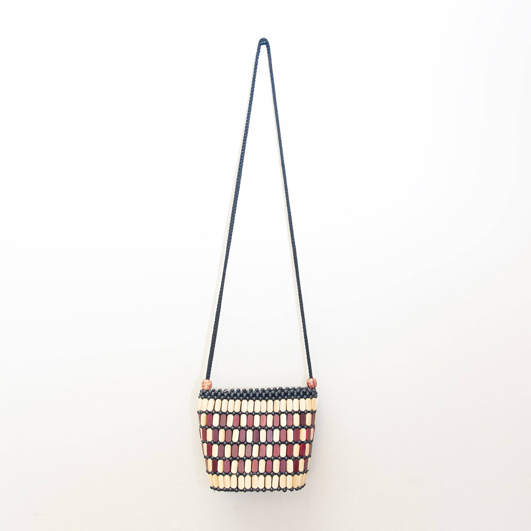 Beaded handbag with a strap on a white background