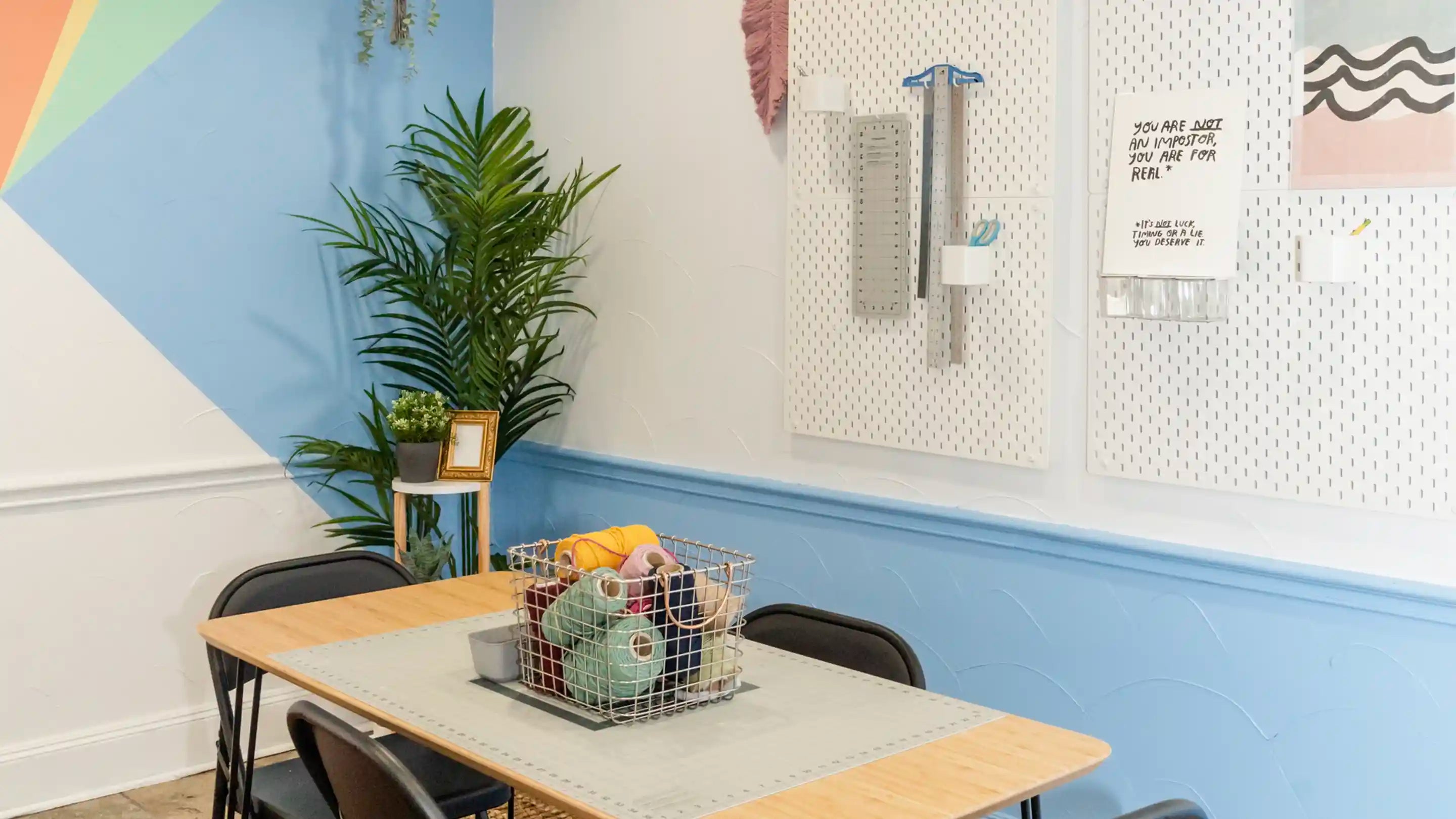 New Origin Shop workshop room. Table with a basket of yarn on top