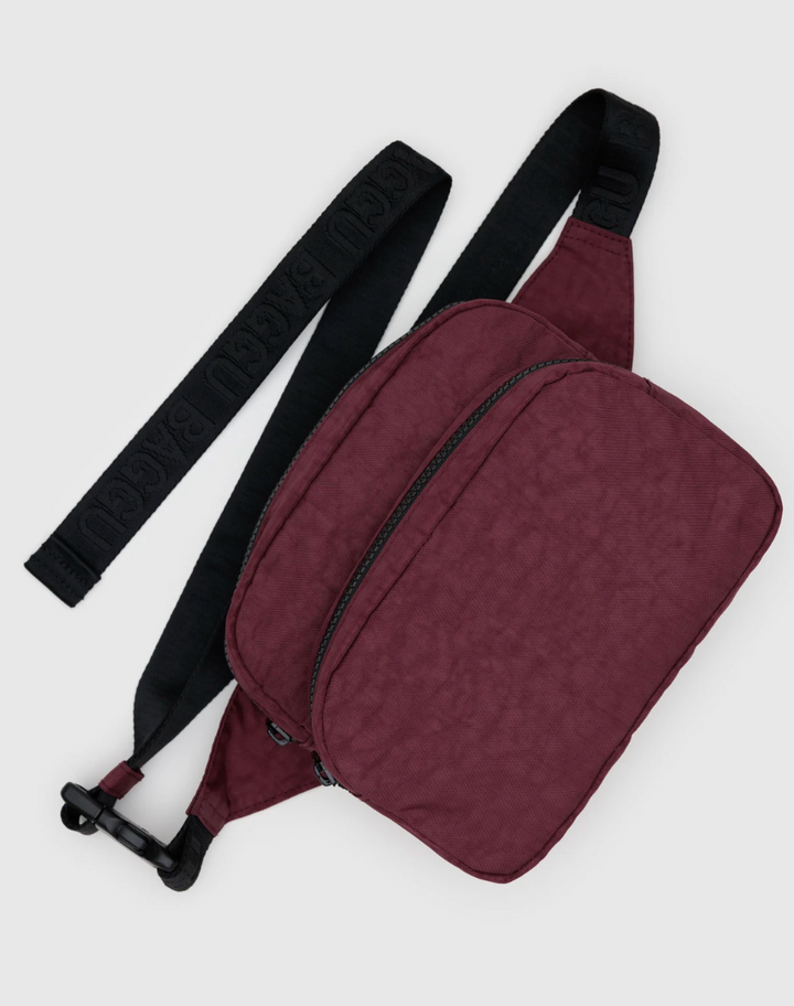 baggu mahogany waist bag (fanny) with a black strap on a light gray background