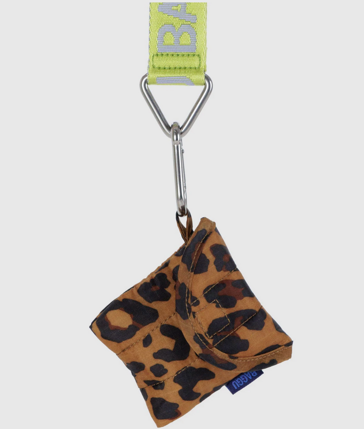 Leopard print pouch with carabiner and green strap on a white background