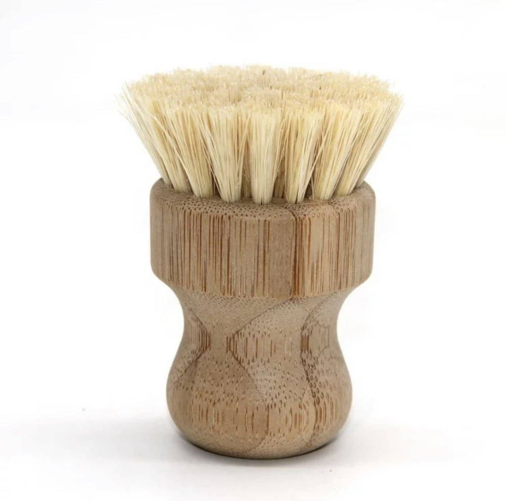Wooden sissal brush with bristle head on a white background