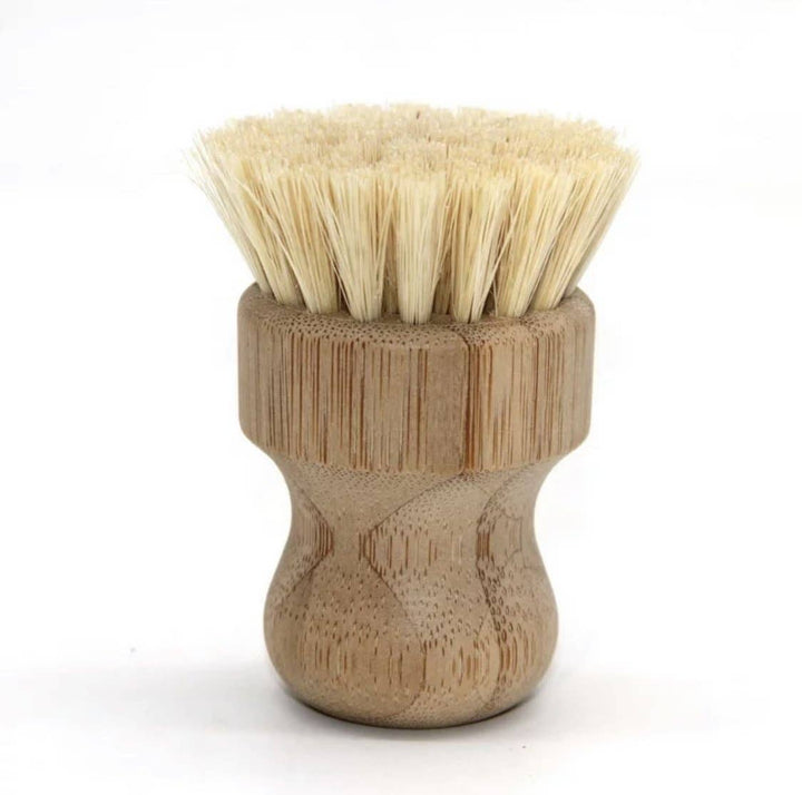 Wooden sissal brush with bristle head on a white background