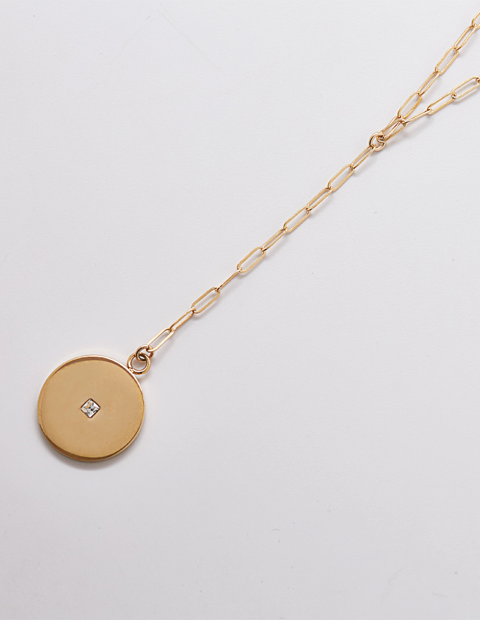 A unique take on the classic lariat necklace – featuring a gold pave disc coin pendant with an unique link style bar chain. Spring Clasp. Weight: Light Weight. Material: Chain: 14kt Gold Filled; Pendant: Gold Plated Dimensions: Approx. Chain: 14″ with 2″ extender ; Lariat: 3″ Pendant:15mm Color: Gold. Hypoallergenic