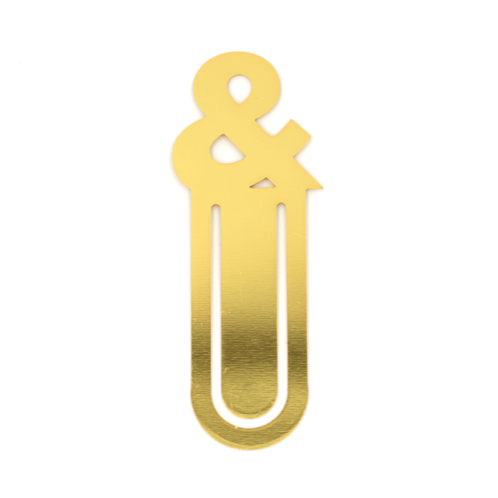 ampersand Metal and enamel bookmark clip. Measures 2.75" tall and comes packaged on a printed card with a protective-sleeve bag.