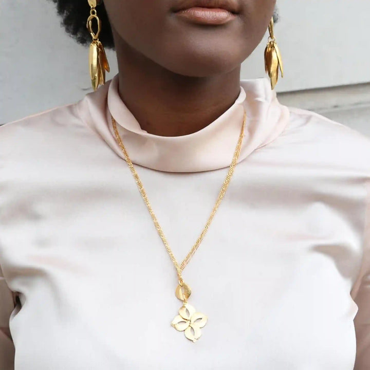 A Black female model wearing a If the Rain Comes First Necklace