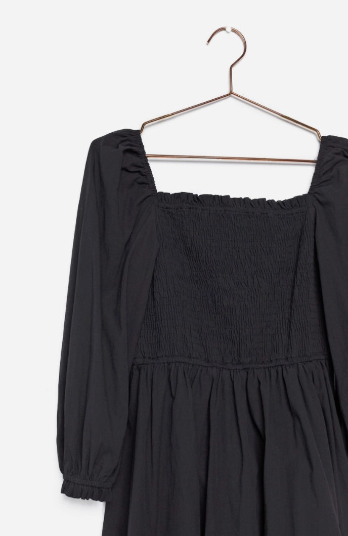 black bodice, bishop sleeves and gathered skirt.