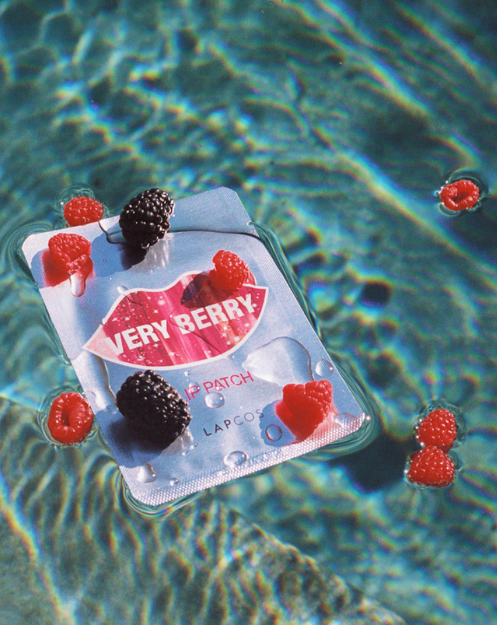 very berry lip patch floating in water, berries floating on top as props