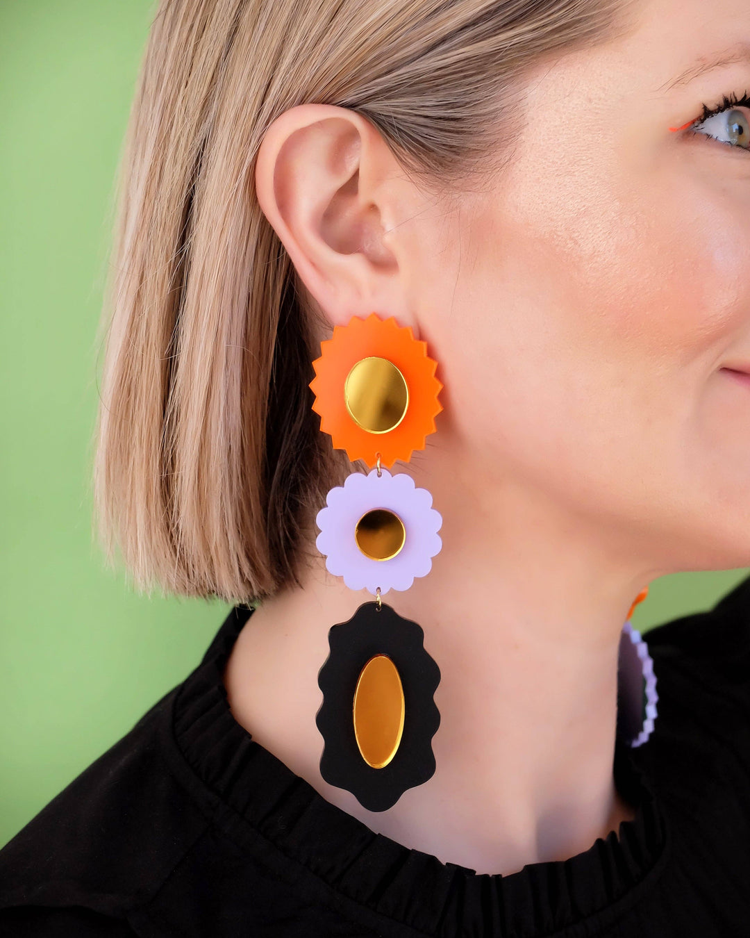 orange, purple, black earrings