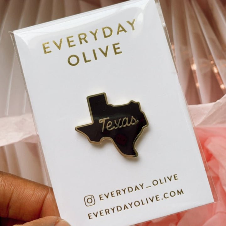 black and gold texas shape and word enamel pin everyday olive